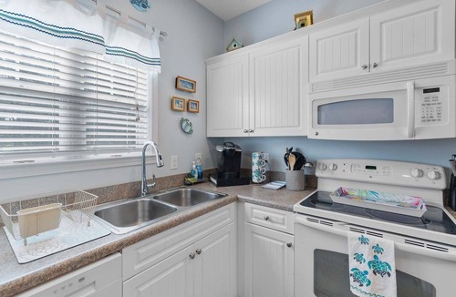 Southport House | 4136 Vanessa Dr Unit 13: 3-bedroom condo in Southport with a private pool