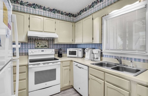 Caswell Beach Condo | Balcony At The Beach: Oceanfront Condo with Community Pool