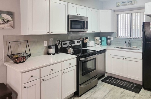 West Panama City Beach Apartment | Beautiful PCB Townhome: Balcony & Resort Amenities
