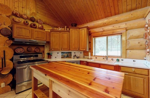 San Juan River Village Cabin | Beautiful Riverfront Log Cabin with Mountain Views, Firepit, and Gas Grill
