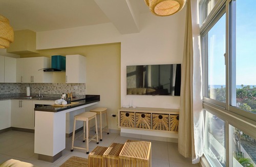 Quisqueya Apartment | Caribbean Sunset Soak Apt.In the center of town, steps from the Juan Dolio Beach