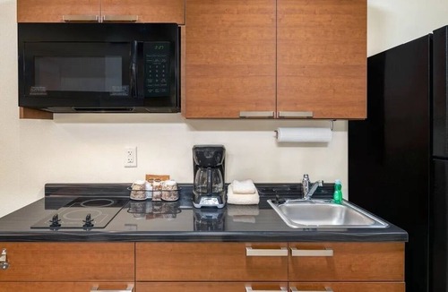 West Jordan Hotel | Family-Friendly Room Near Jordan Landing w/Kitchen! Pets Allowed