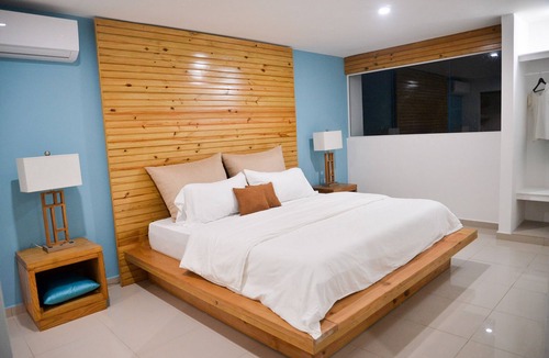 Villas Ana Maria Hotel | Guest-friendly Luxury hotel room in central Sosua, with private bar