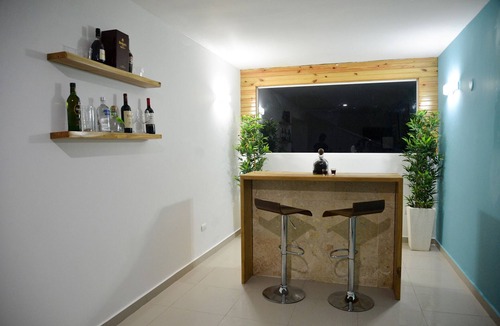 Villas Ana Maria Hotel | Guest-friendly Luxury hotel room in central Sosua, with private bar