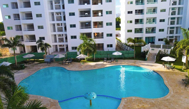 A peaceful and cozy place with an art of the state pool and near to the beach.