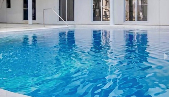 Condo with private balcony with pool view