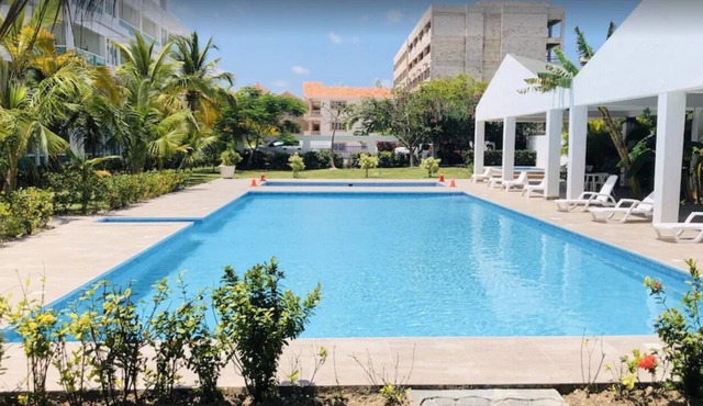 Cozy 2-Bedroom Condo with 2 pools by the beach