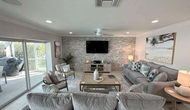 Luxurious Waterfront Retreat! Oversized Heated Pool and expansive outdoor area!